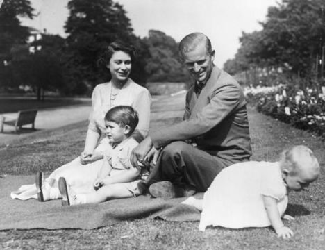 Princess Elizabeth and Prince Philip, Duke of Edinburgh with their two children, Prince Charles and Princess Anne in the grounds of Clarence House, London.
